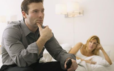 Tense couple in a bedroom