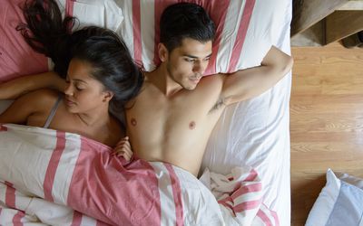 Man and woman in bed.